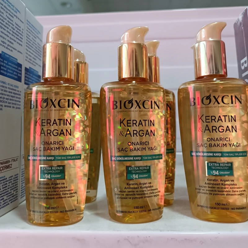 روغن مراقبتی و ترمیم کننده مو بیوکسین حاوی کراتین و آرگان مناسب انواع مو 150 میل